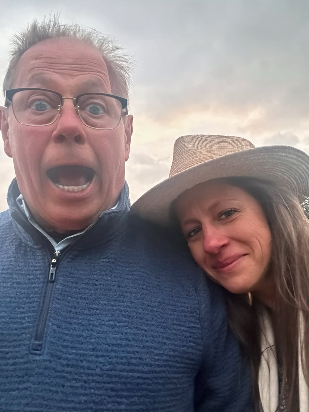 Sarah and her dad, outdoors at dusk.